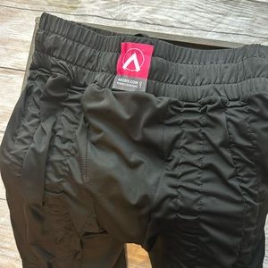 AGOGIE resistant band, pants, size L.  Half sock under foot creates resistance.